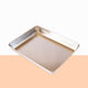 Metal scrap rectangle tray on a peach and white background